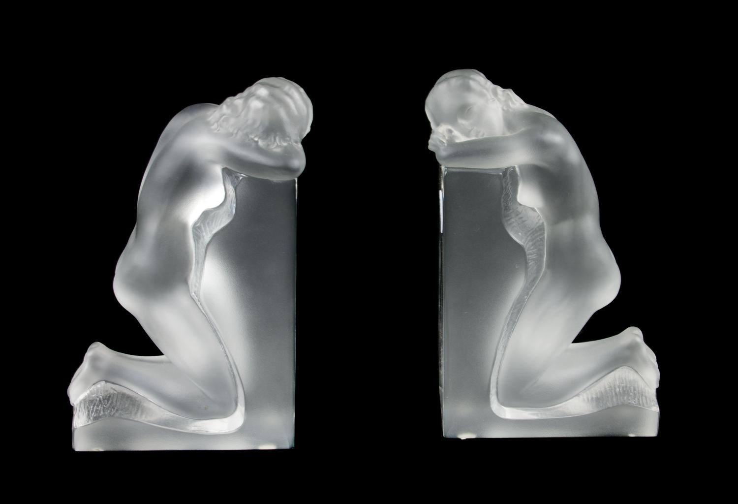 A Pair of Lalique Molded and Frosted Glass Bookends Height 8 3/4 inches.