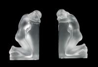 A Pair of Lalique Molded and Frosted Glass Bookends Height 8 3/4 inches.