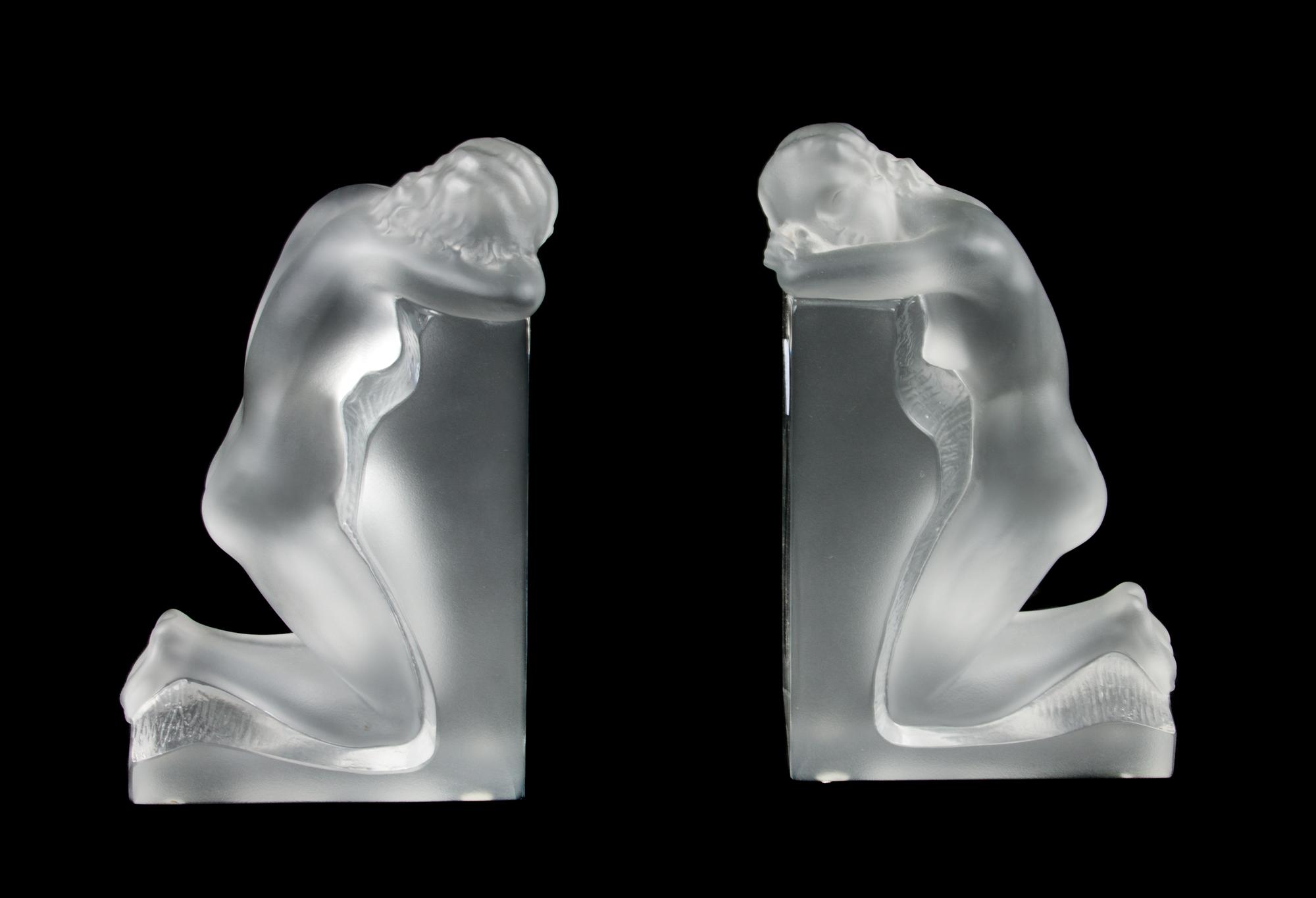 A Pair of Lalique Molded and Frosted Glass Bookends Height 8 3/4 inches.