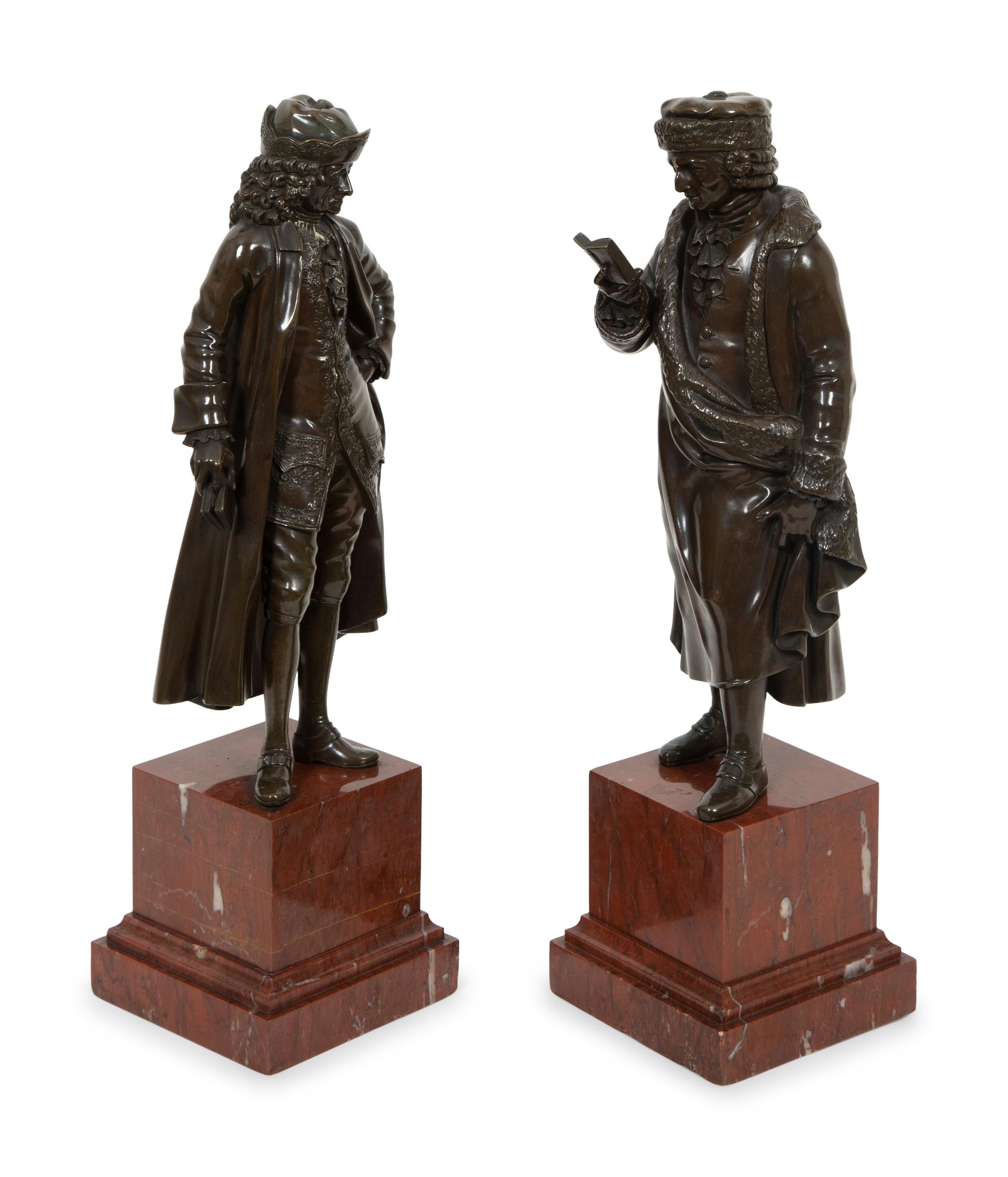 A Pair of Bronze Sculptures of Voltaire and Rousseau