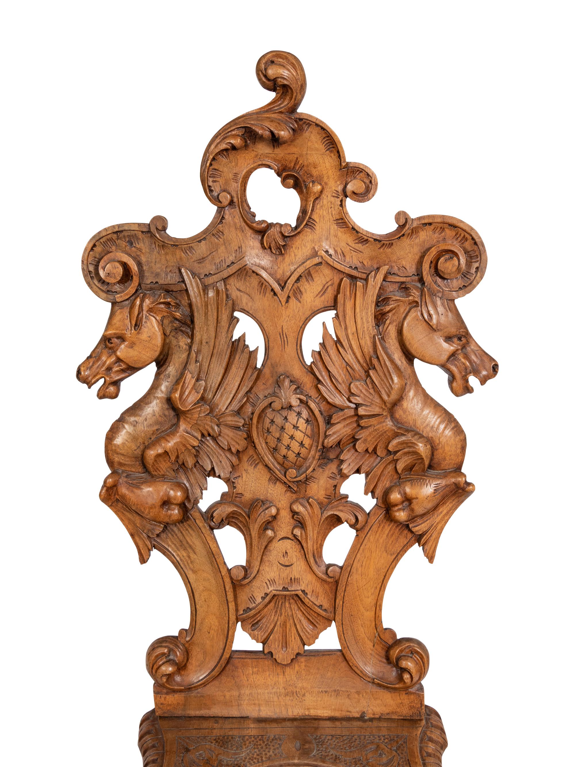 A Pair of Italian Carved Walnut Sgabello Chairs