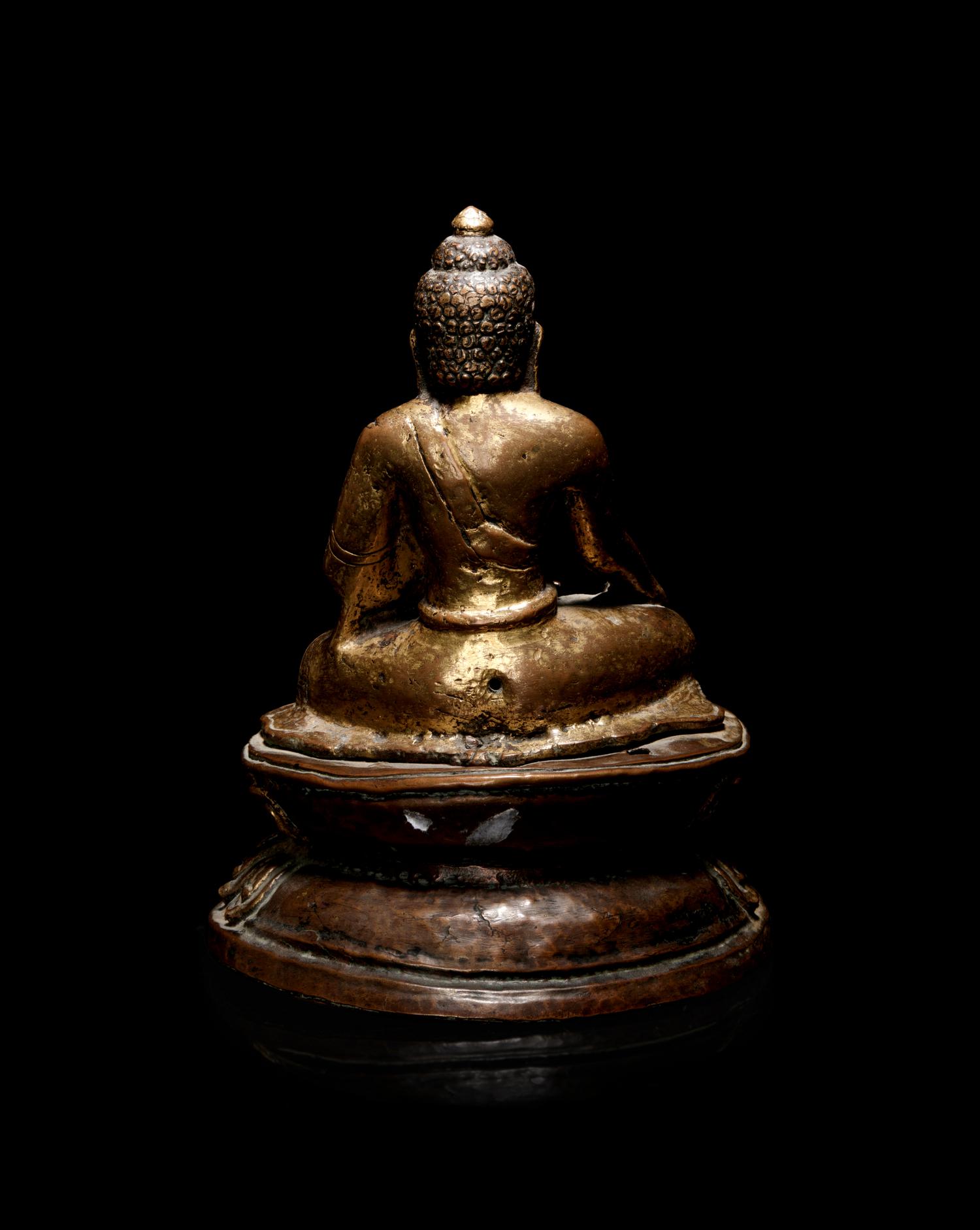 A Nepalese Gilt Bronze Figure of Buddha Shakyamuni