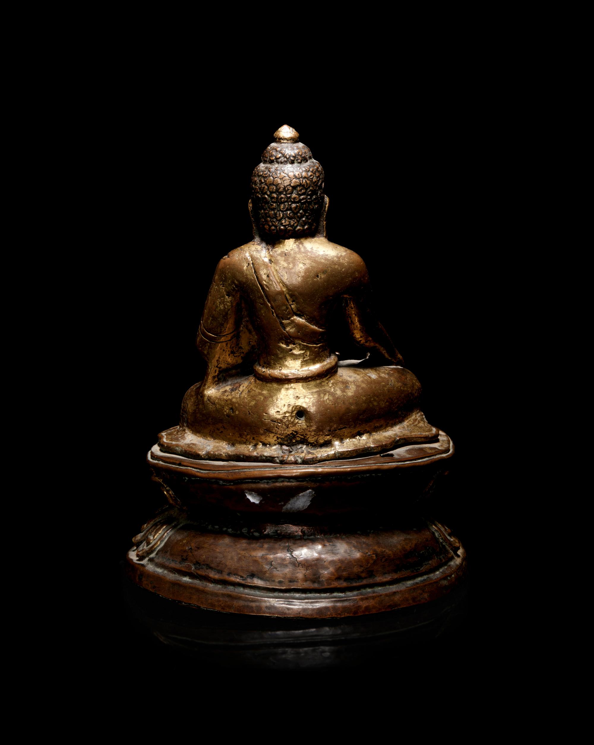 A Nepalese Gilt Bronze Figure of Buddha Shakyamuni