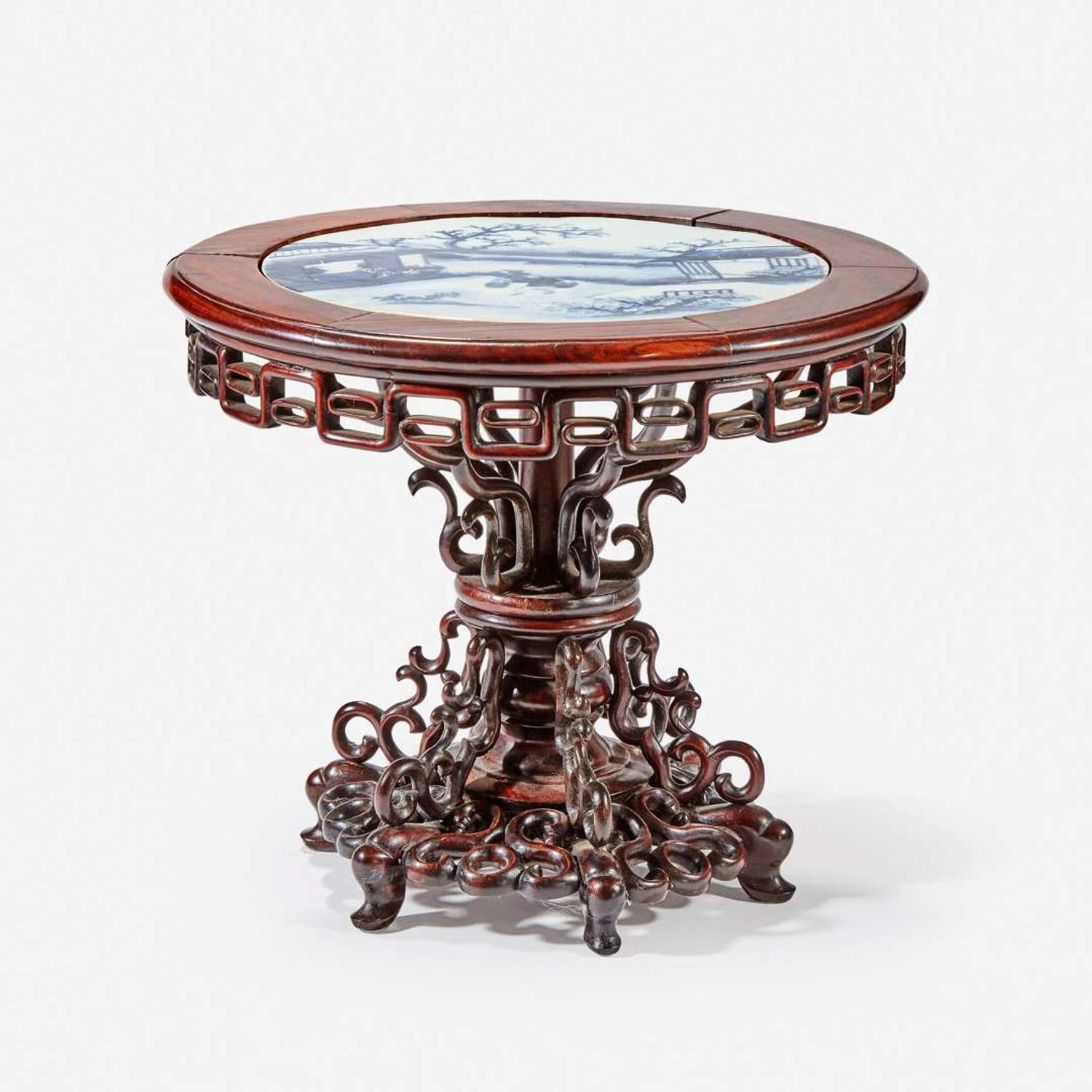 A Chinese blue and white porcelain-inset hardwood revolving small stand 20th Century