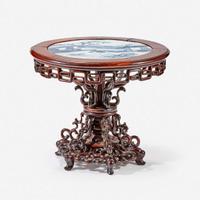 A Chinese blue and white porcelain-inset hardwood revolving small stand 20th Century