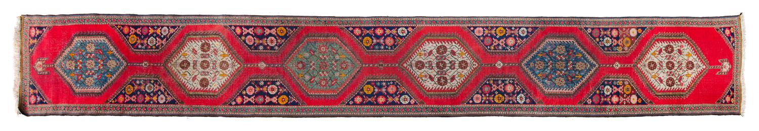 A Northwest Persian Wool Runner 17 feet 7 inches x 2 feet 5 inches. — 19TH CENTURY