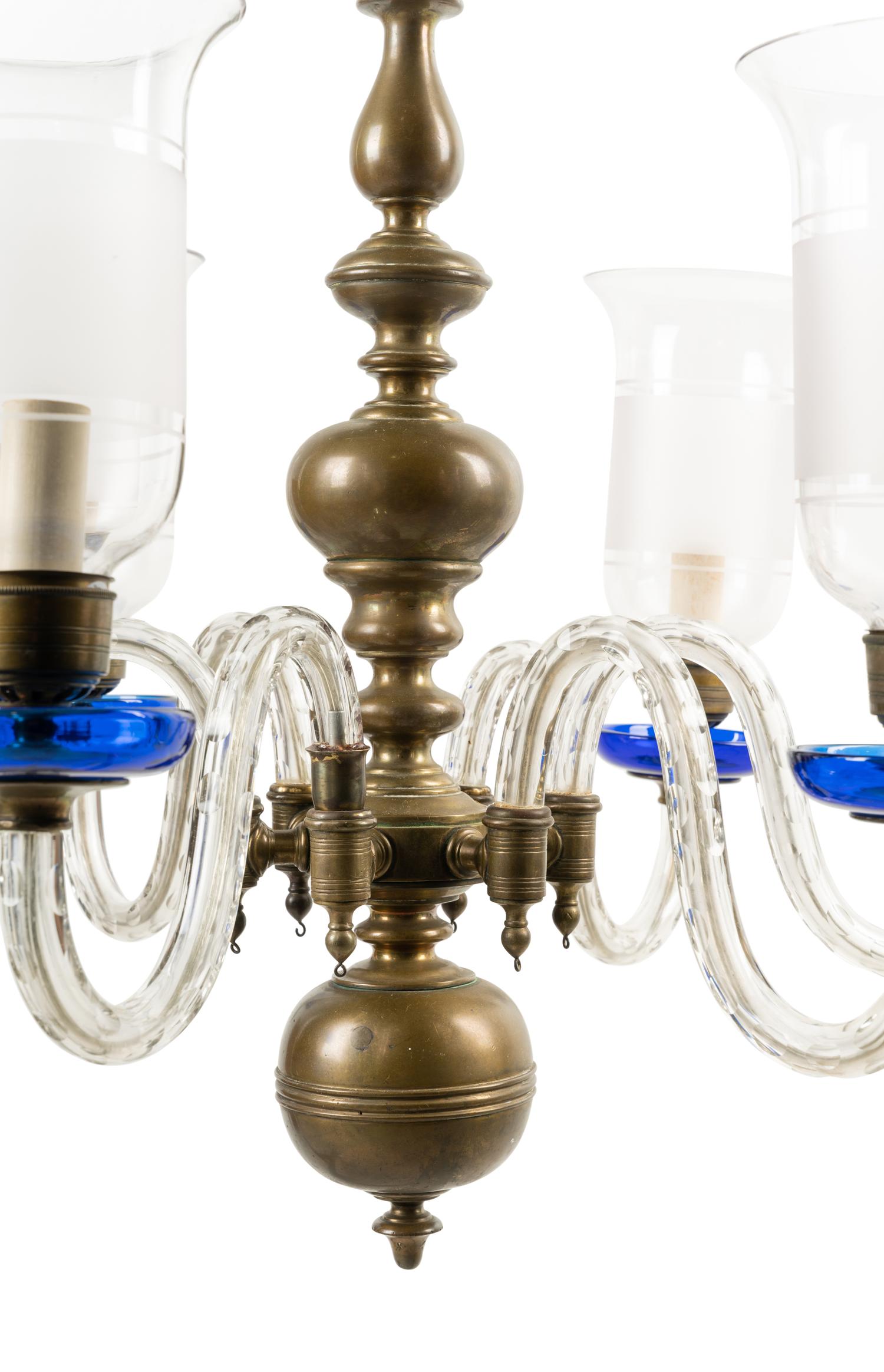 A Baroque Style Brass and Glass Six-Light Chandelier