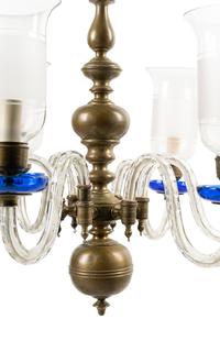 A Baroque Style Brass and Glass Six-Light Chandelier