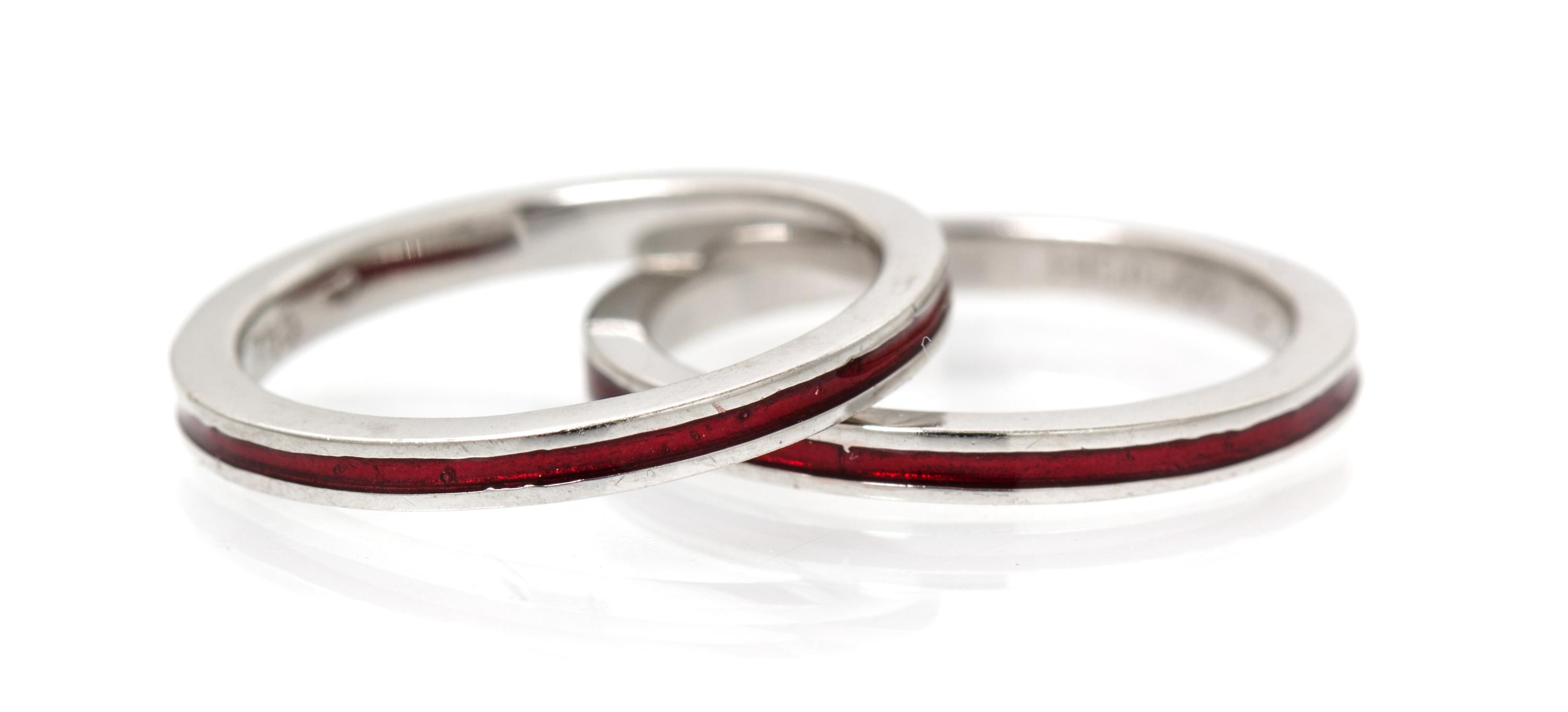 A Pair of 18 Karat White Gold and Red Enamel Rings, Hidalgo. 3.30 dwts.