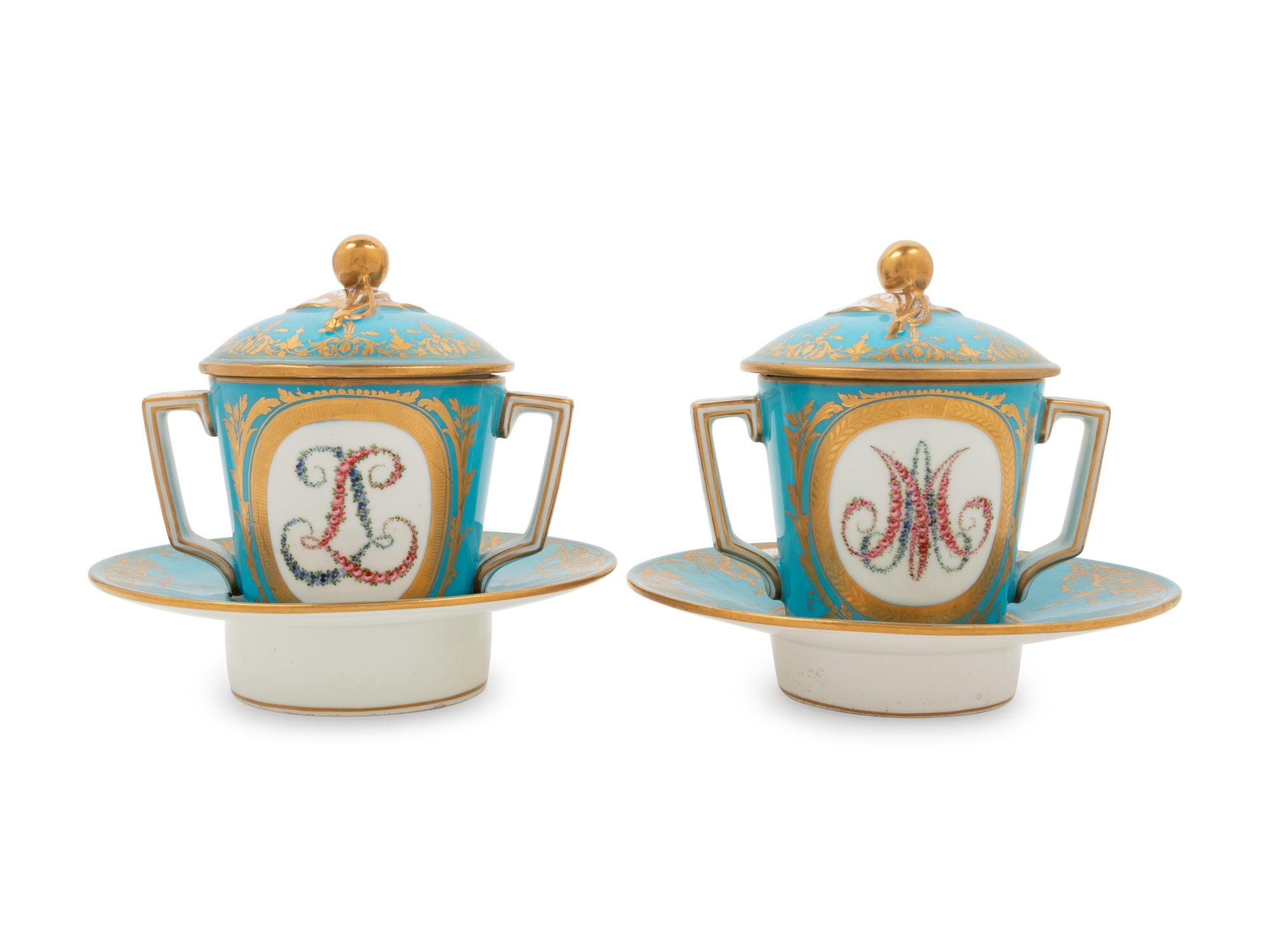 A Pair of Sèvres Style Porcelain Cups and Saucers