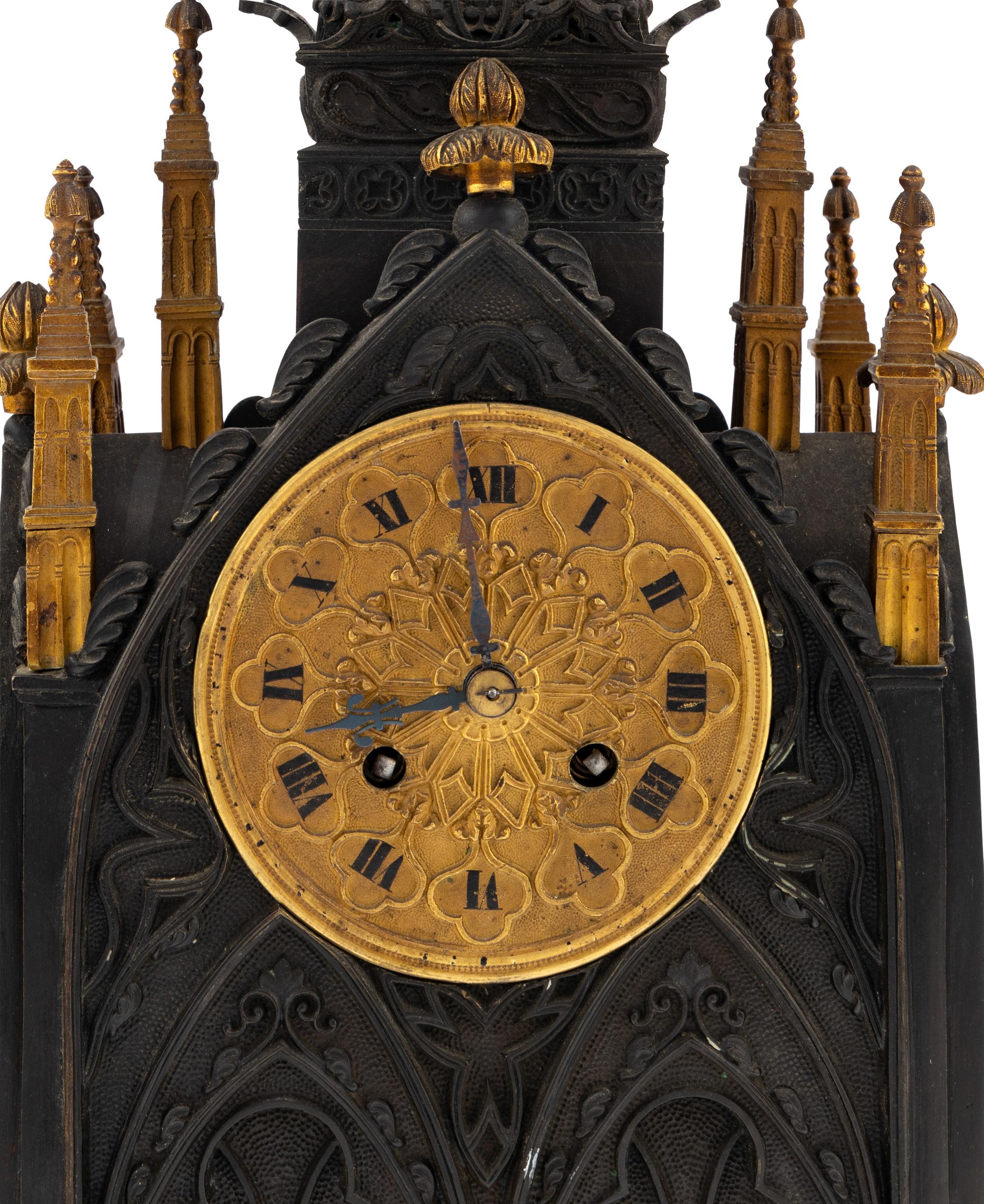 A French Patinated and Parcel Gilt Bronze Cathedral-Form Clock