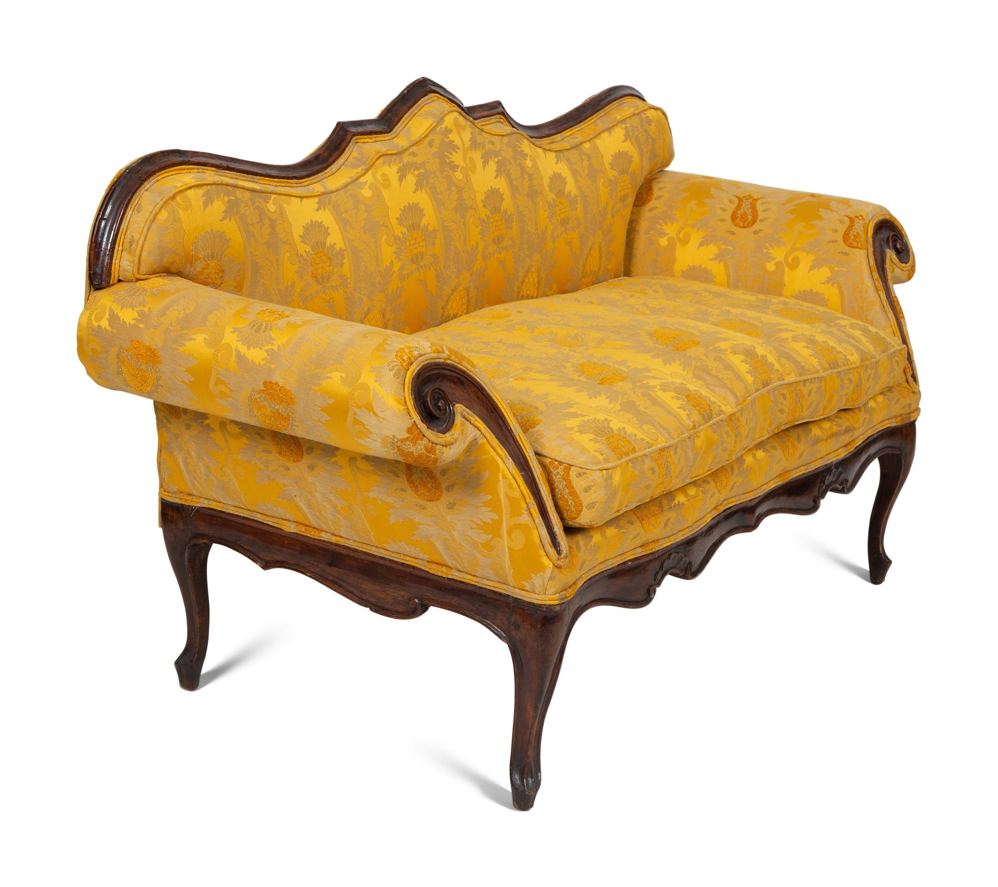 A Louis XV Provincial Carved Walnut Settee