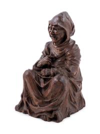 A Gothic Revival Carved Oak Figure