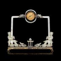 An Edward I. Farmer White Jade and Silver Mounted Chinoiserie Desk Clock, Circa 1930 Edward I. Farmer約1930年製中國風白玉童子座鐘