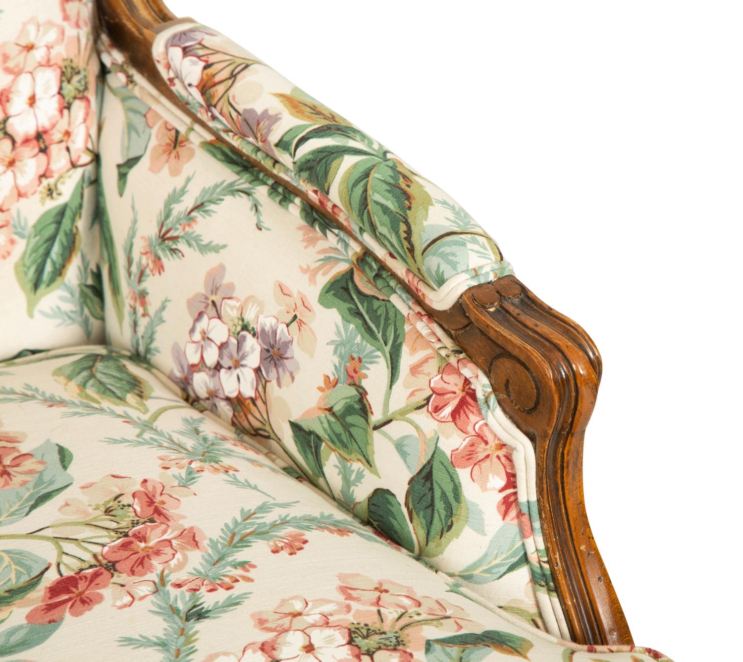 A Pair of Louis XV Style Walnut Bergères