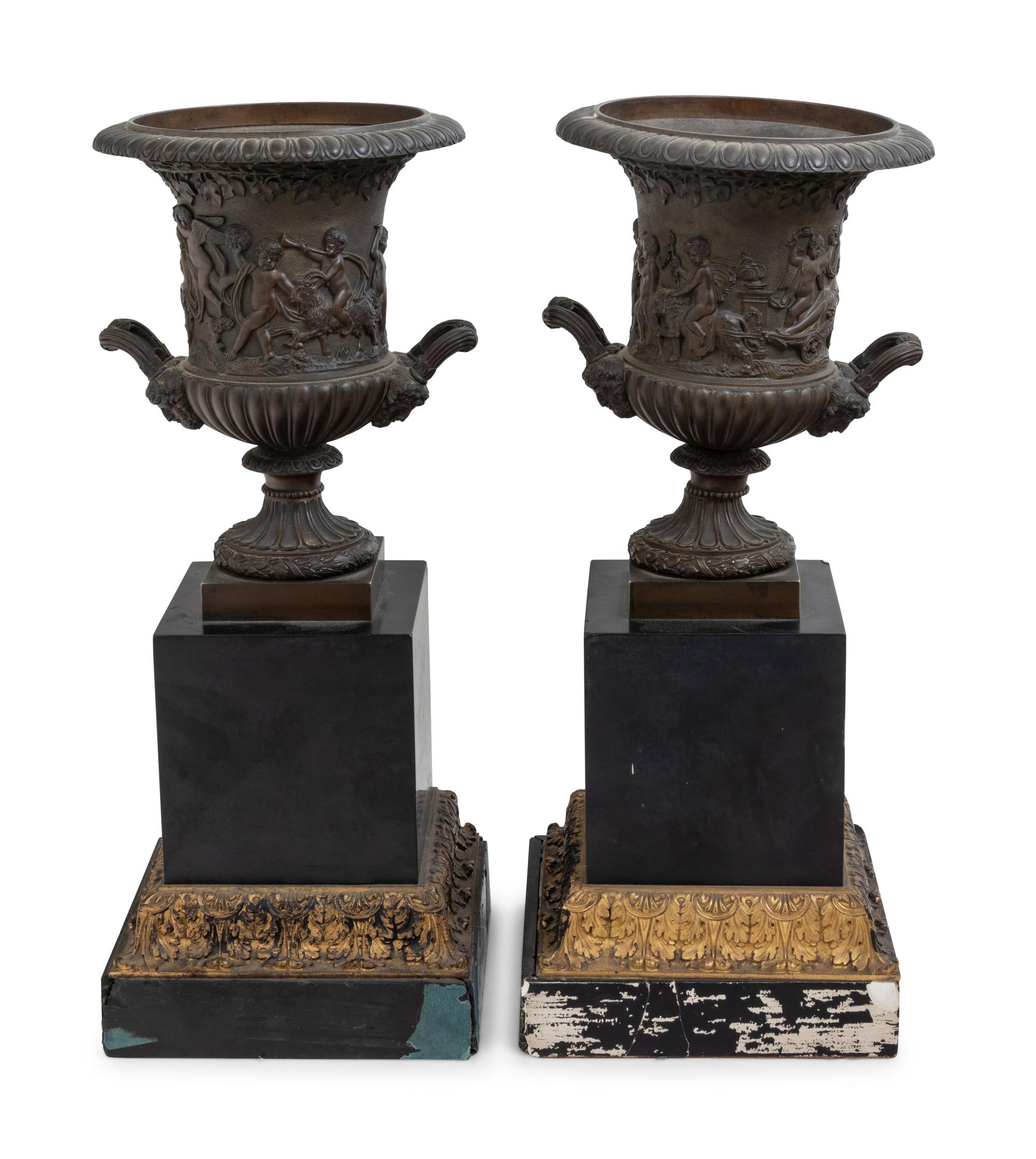 A Pair of Continental Bronze Urns with Associated Plinths
