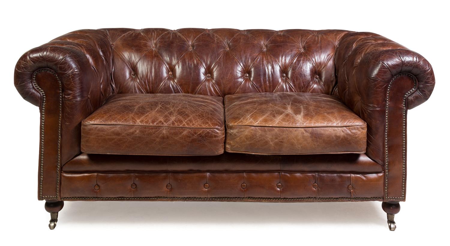 A Leather Upholstered Chesterfield Sofa Height 31 x width 70 x depth 38 1/2 inches. — 20TH CENTURY