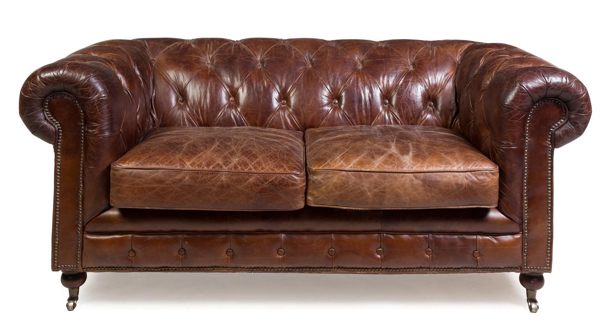 A Leather Upholstered Chesterfield Sofa Height 31 x width 70 x depth 38 1/2 inches. — 20TH CENTURY
