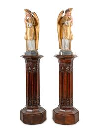 A Pair of Painted and Parcel Gilt Figural Altar Prickets with Associated Gothic Revival Pedestals