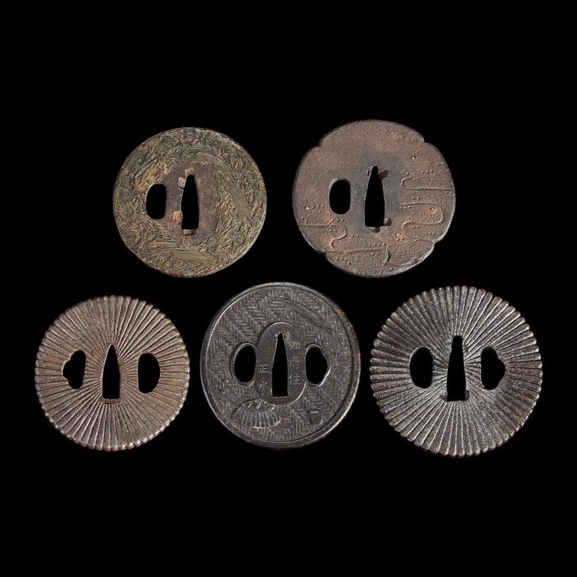Group of fifteen assorted Japanese tsuba Meiji period and earlier