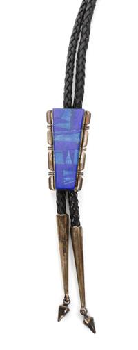 A Navajo Silver and Lapis Bolo, J. Charley Height 2 1/4 x 1 1/4 inches.