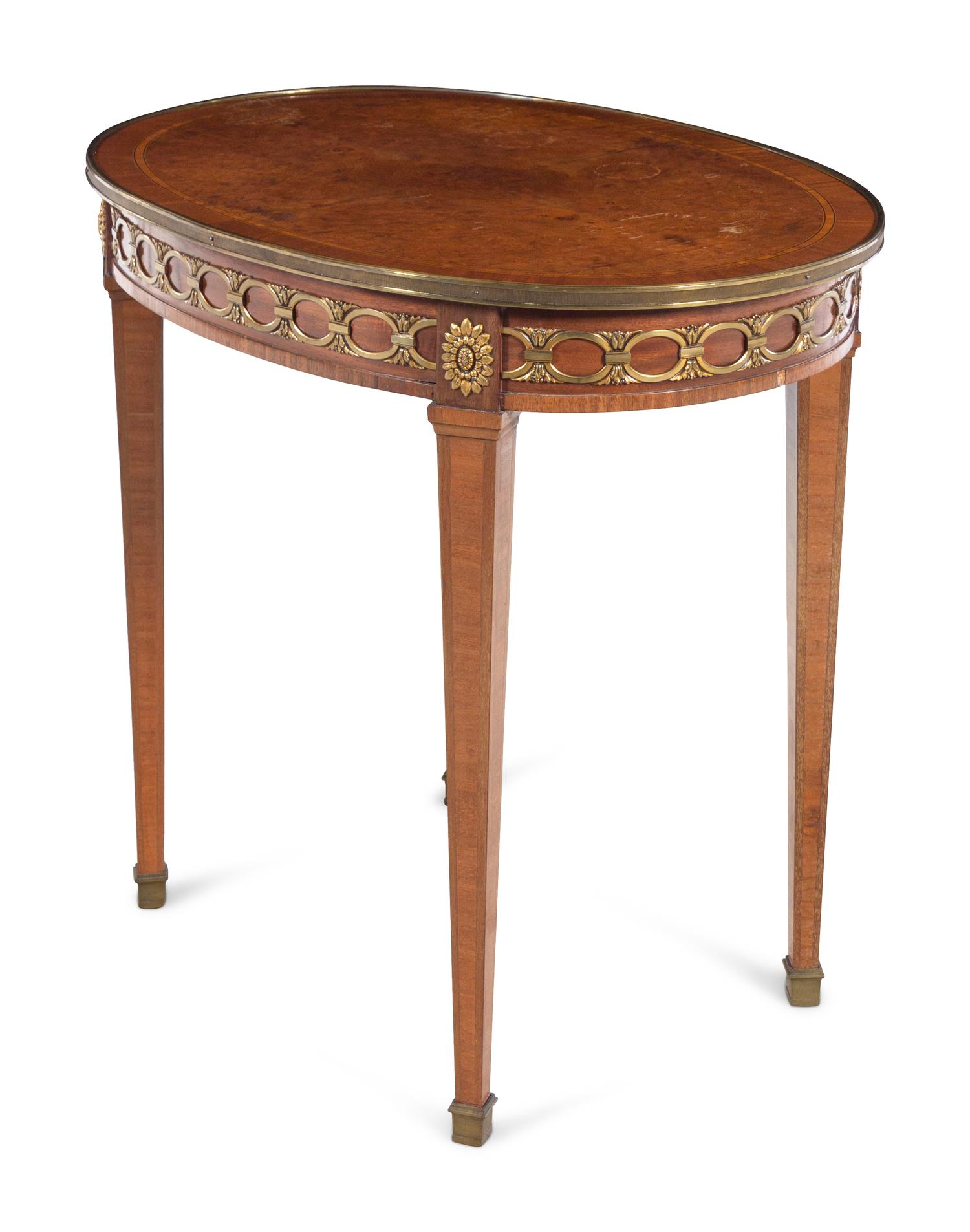 A Louis XVI Style Gilt Bronze Mounted Mahogany and Amboyna Guéridon