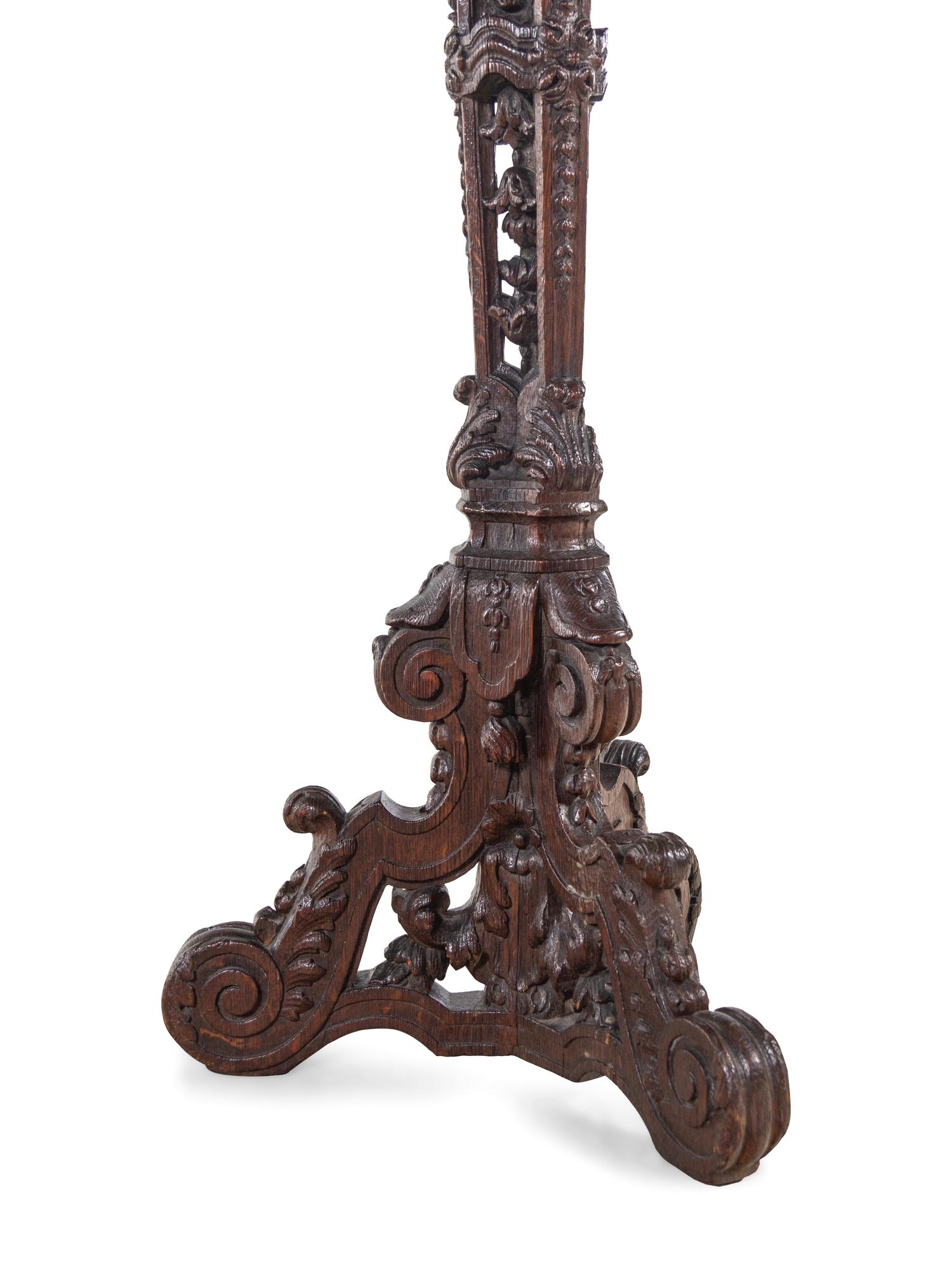 A Pair of Louis XIV Style Carved Oak Torchères