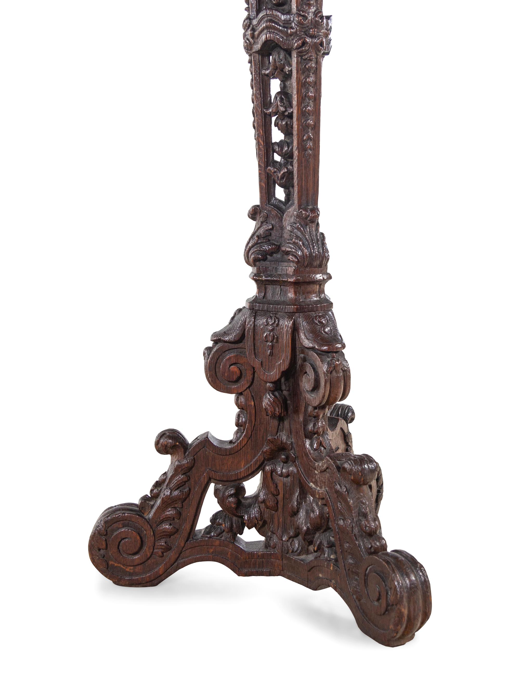 A Pair of Louis XIV Style Carved Oak Torchères