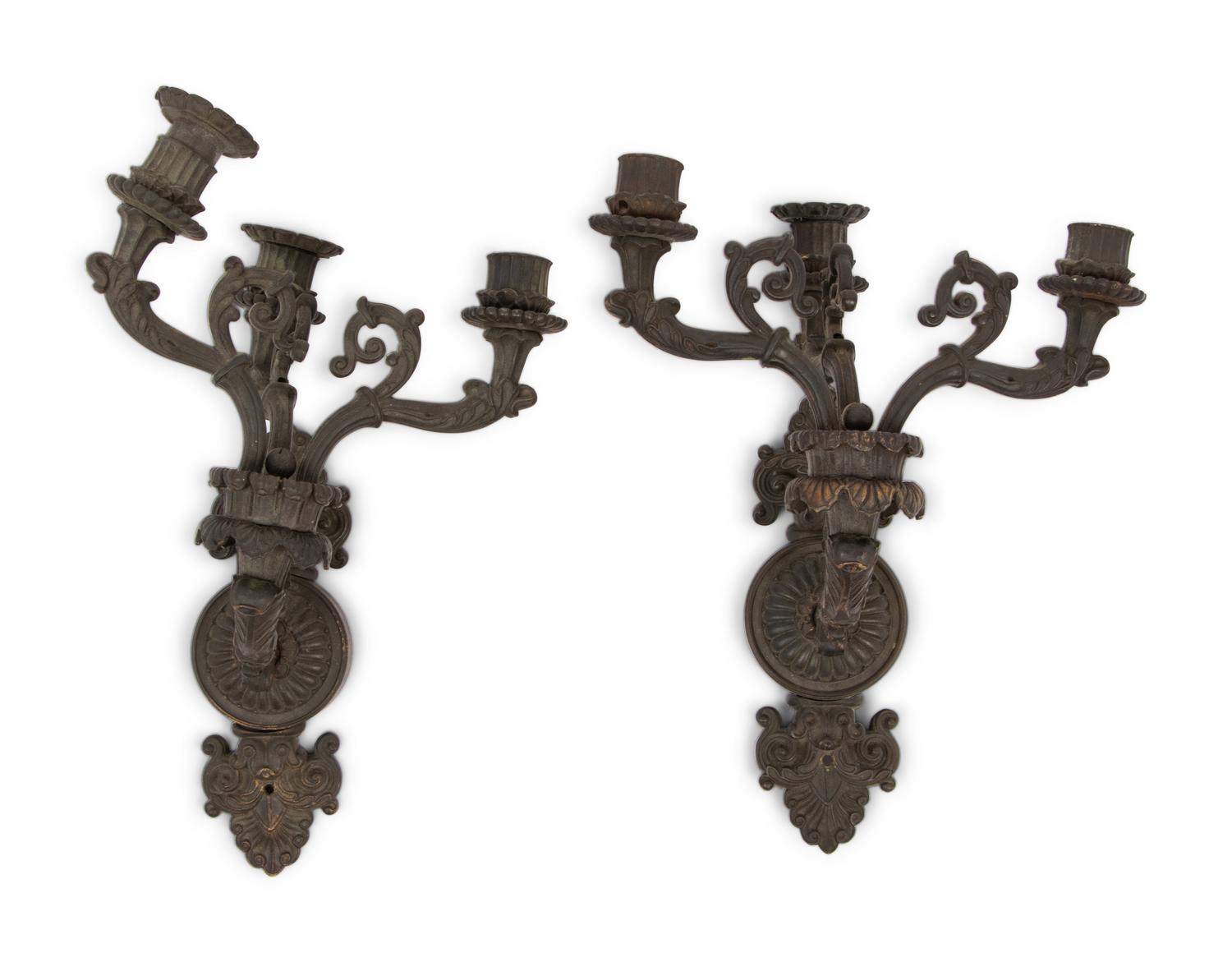 A Pair of Neoclassical Patinated Metal Three-Light Wall Sconces