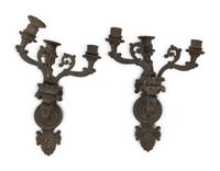 A Pair of Neoclassical Patinated Metal Three-Light Wall Sconces