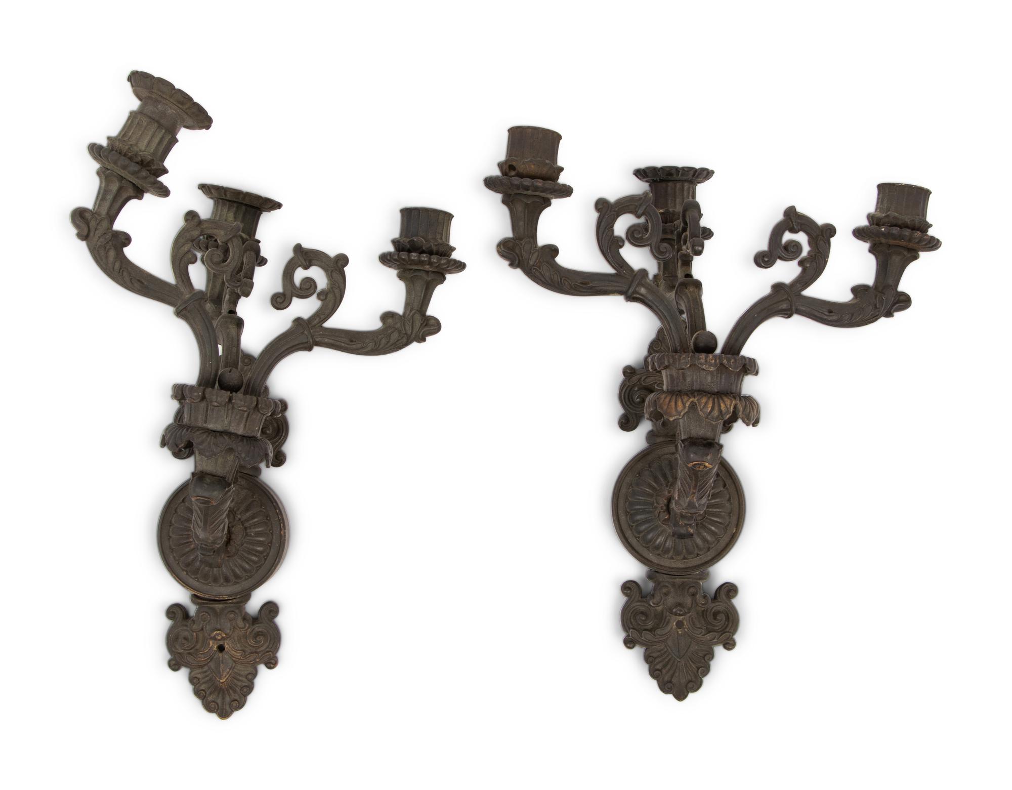 A Pair of Neoclassical Patinated Metal Three-Light Wall Sconces