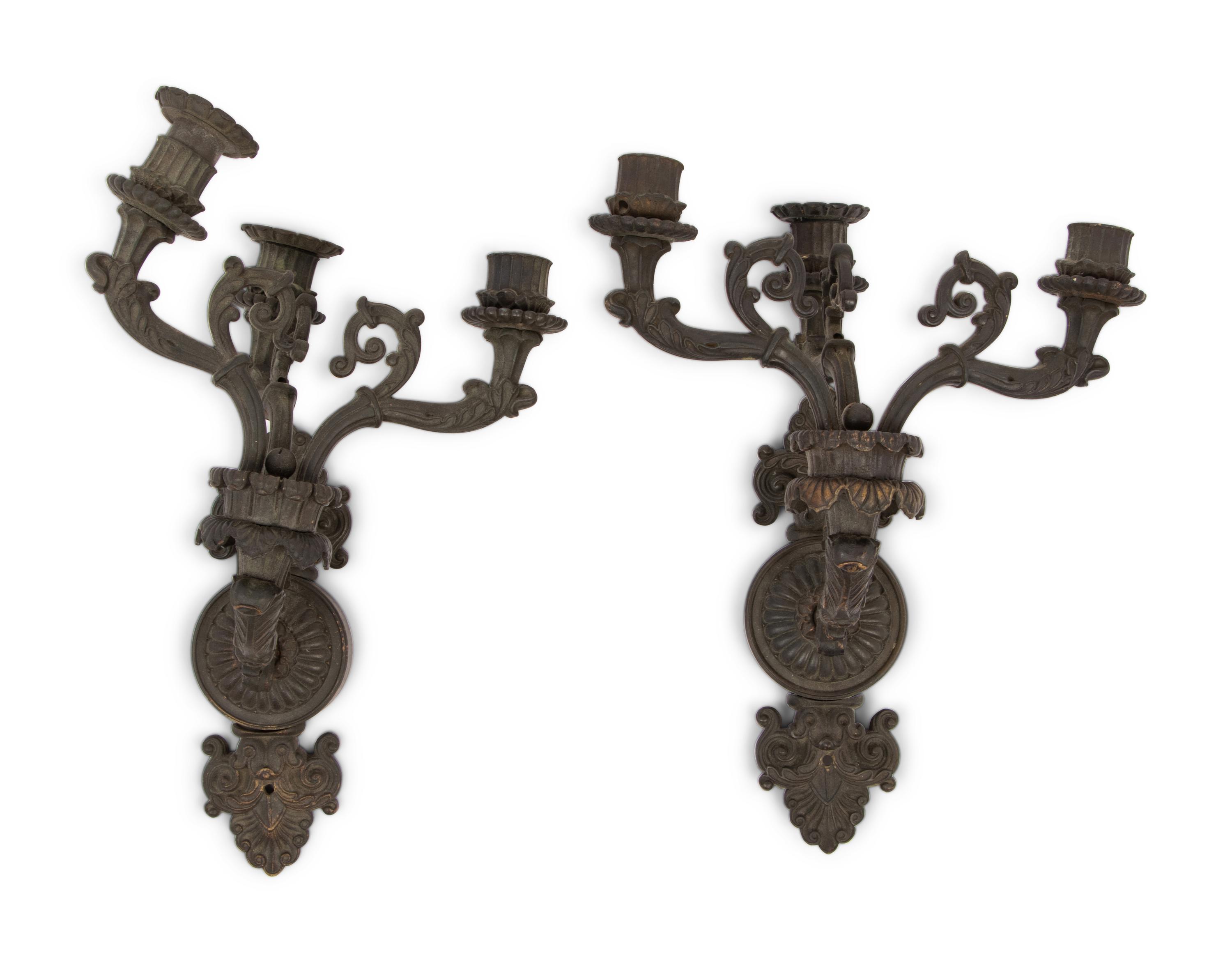 A Pair of Neoclassical Patinated Metal Three-Light Wall Sconces