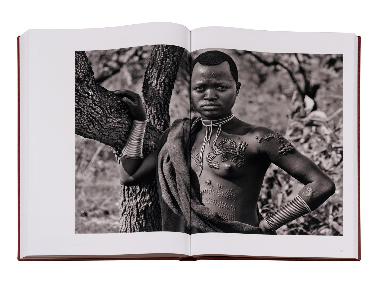 Genesis: Art Edition, Taschen, Paris 2013 (SUMO in two volumes together with booklet, varnished cherry wood lectern designed by Tadao Ando, and signed gelatin silver print Two Mursi Women, Omo Valley, Ethiopia )