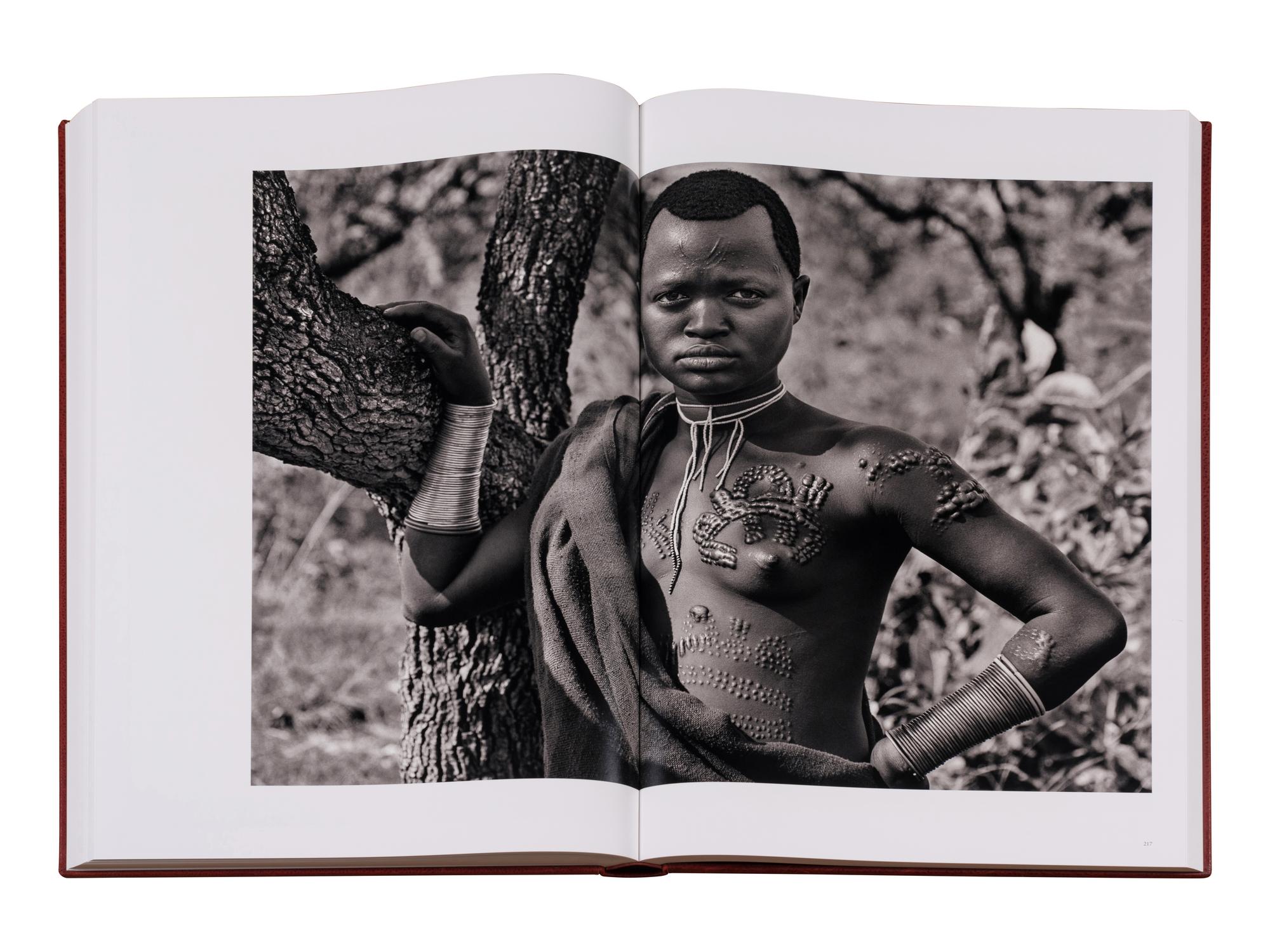 Genesis: Art Edition, Taschen, Paris 2013 (SUMO in two volumes together with booklet, varnished cherry wood lectern designed by Tadao Ando, and signed gelatin silver print Two Mursi Women, Omo Valley, Ethiopia )