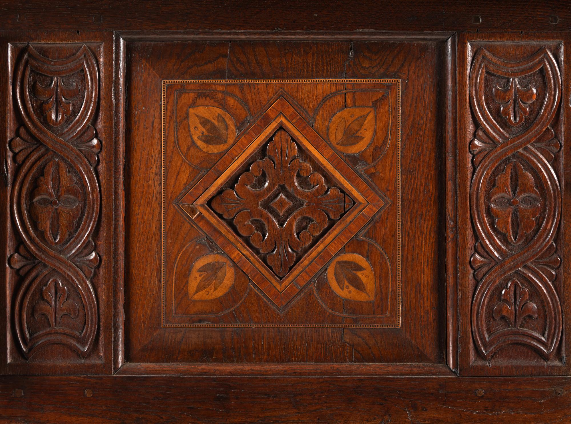 A Jacobean Carved Oak and Marquetry Court Cupboard