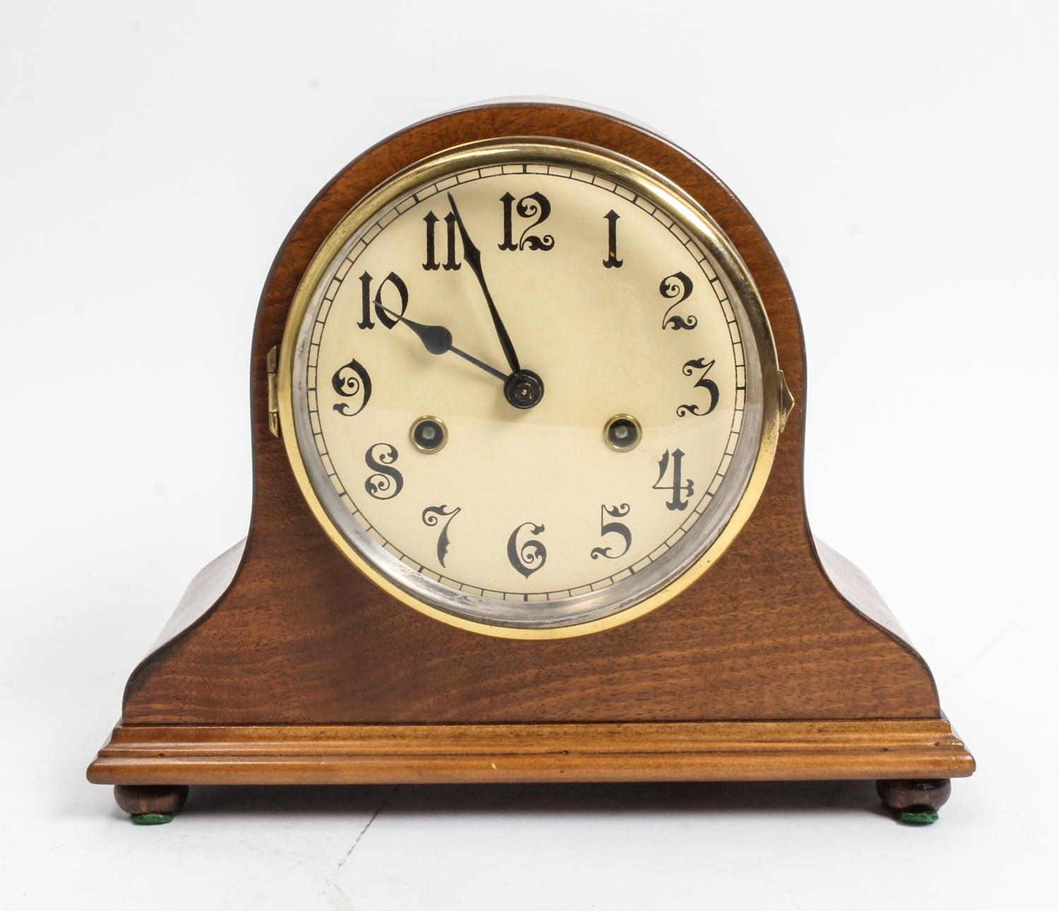 An American Walnut Mantel Clock Height 9 3/8 x width 11 1/2 inches. — 20TH CENTURY