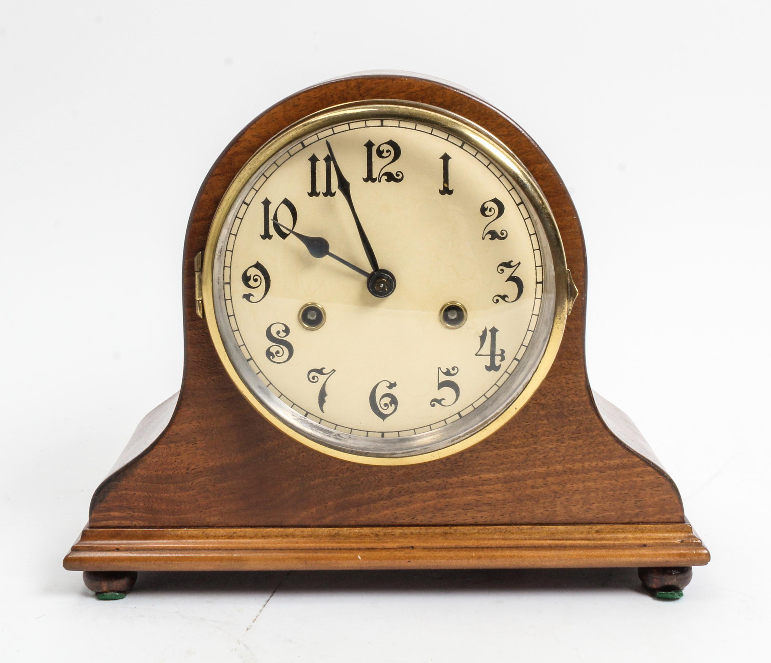 An American Walnut Mantel Clock Height 9 3/8 x width 11 1/2 inches. — 20TH CENTURY