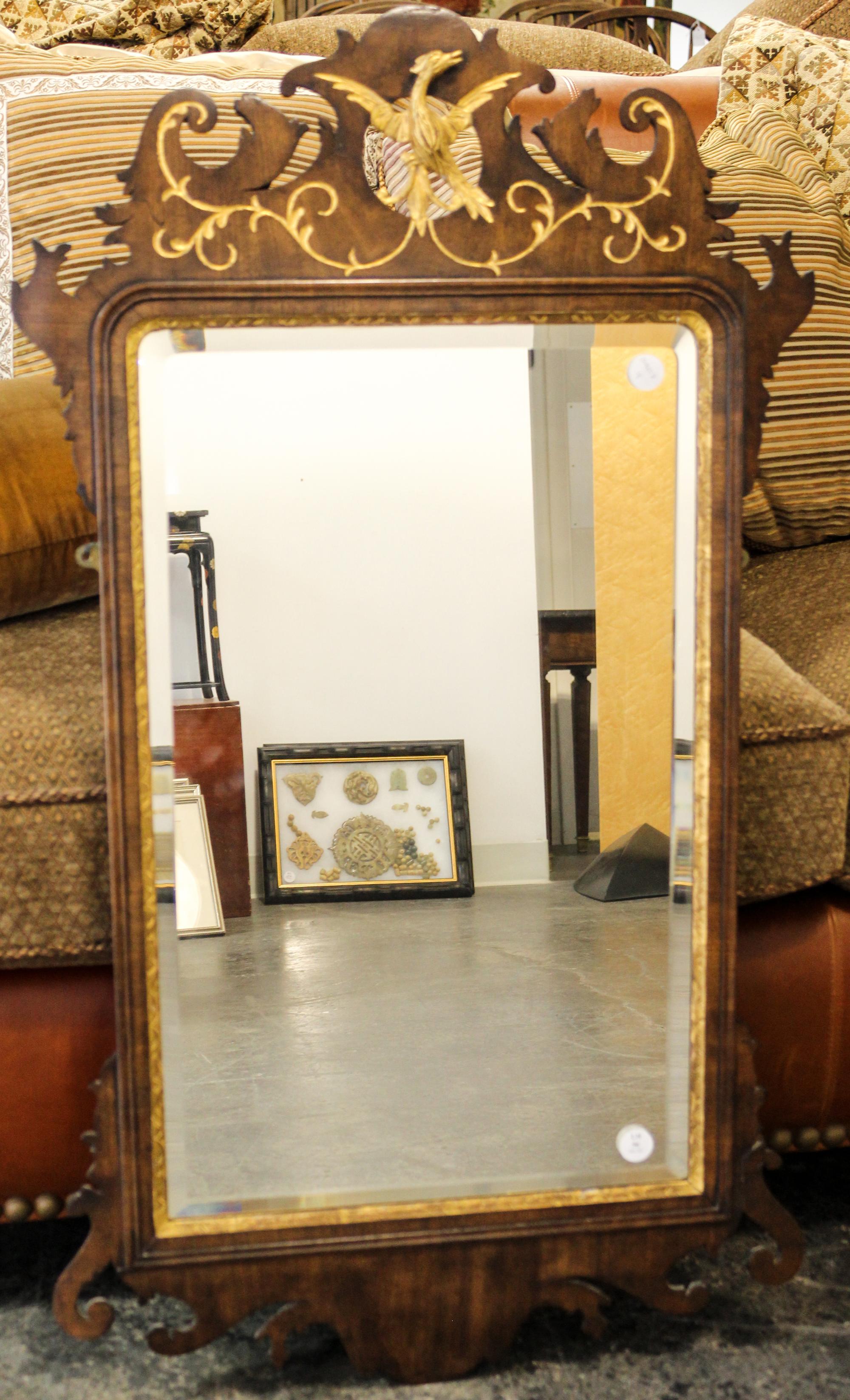 A Chippendale Style Parcel Gilt Mahogany Mirror Height 40 1/2 x width 22 1/2 inches. — 19TH CENTURY