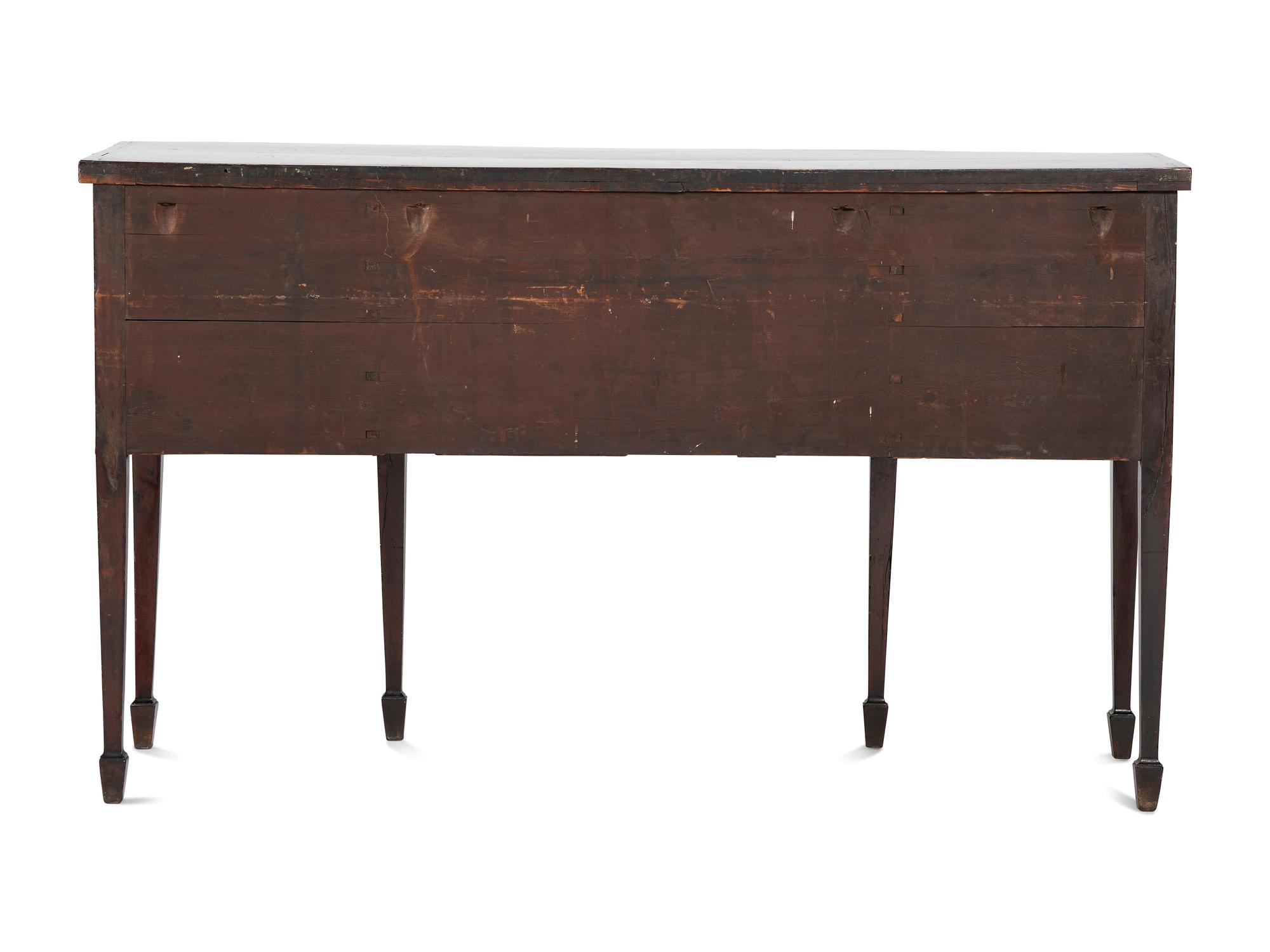 A Regency Carved, Inlaid and Figured Mahogany Bowfront Sideboard