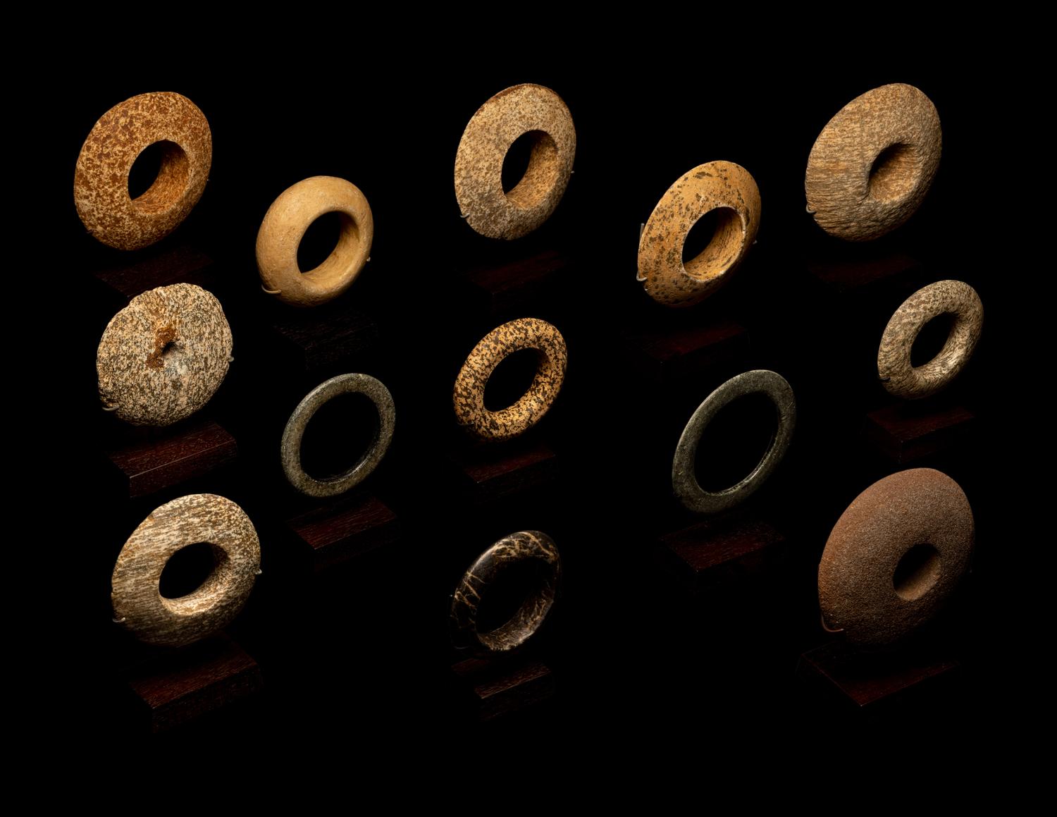 Thirteen Saharan Stone Bracelets and Discoidals