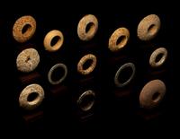 Thirteen Saharan Stone Bracelets and Discoidals
