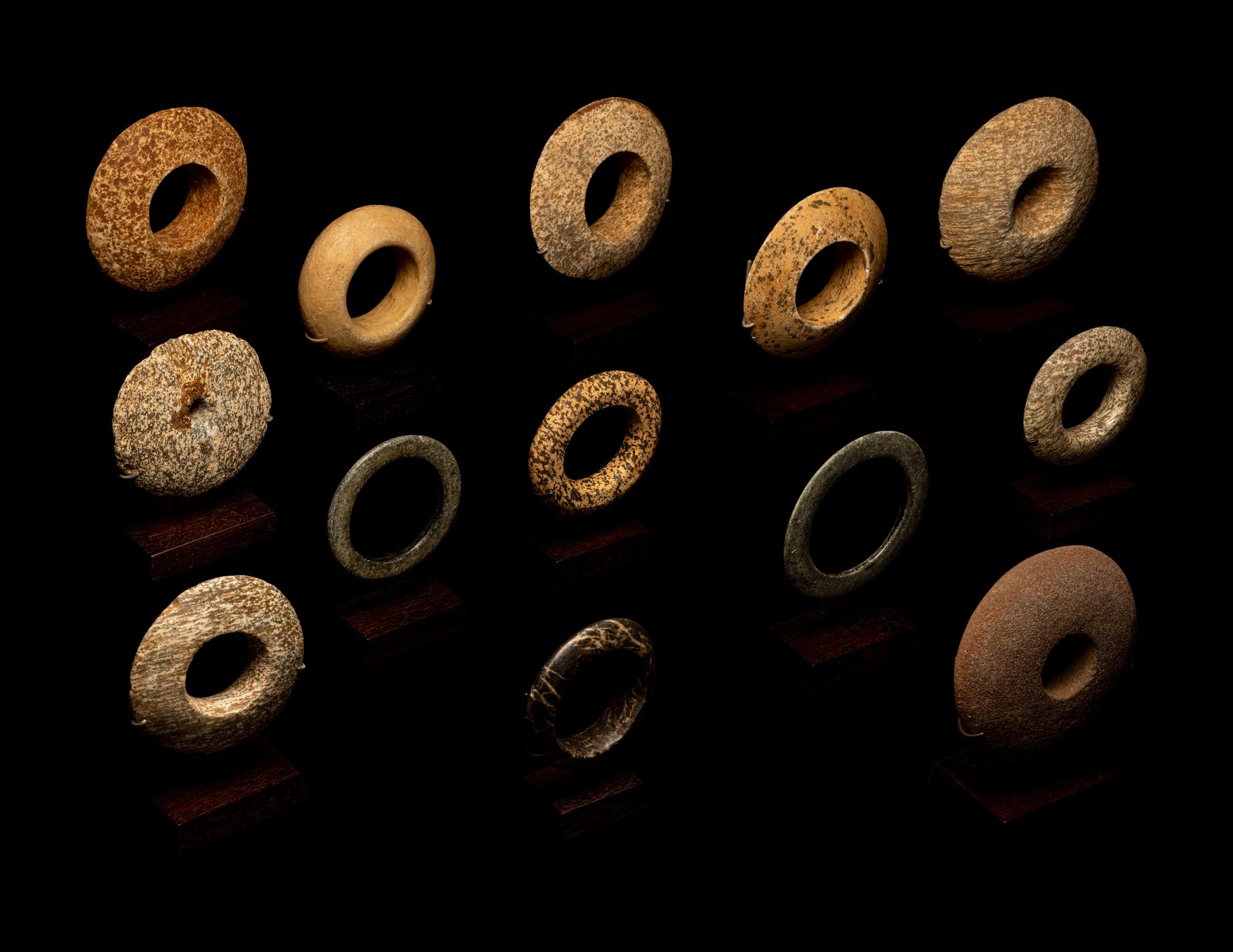 Thirteen Saharan Stone Bracelets and Discoidals