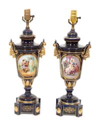 A Pair of Sèvres Style Porcelain Urns Mounted as Lamps