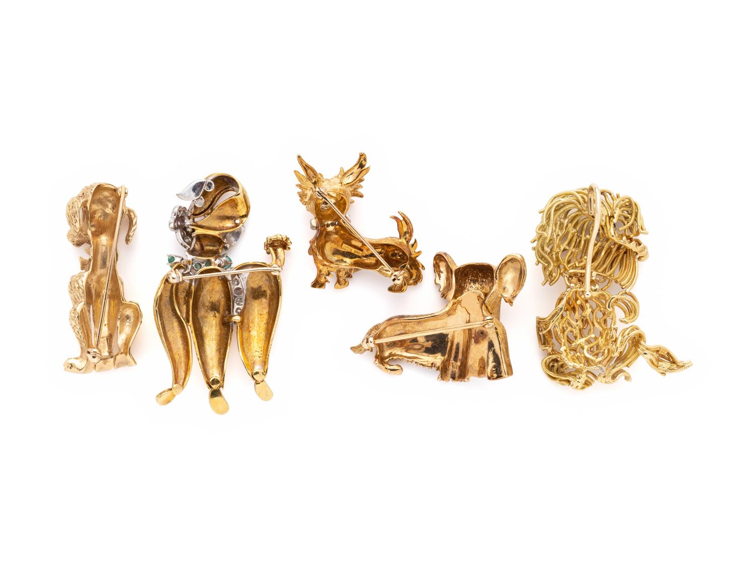 COLLECTION OF YELLOW GOLD DOG BROOCHES