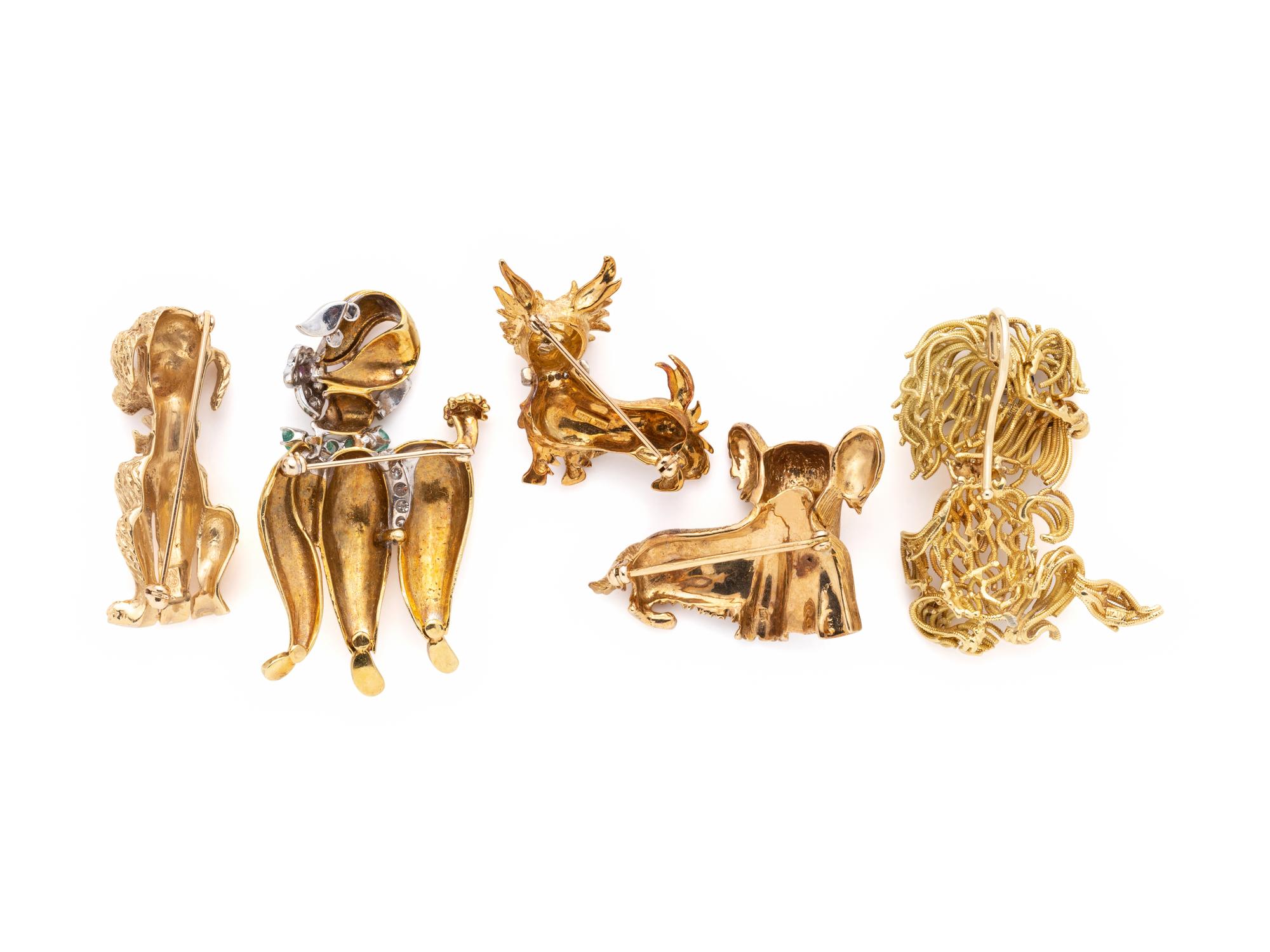 COLLECTION OF YELLOW GOLD DOG BROOCHES