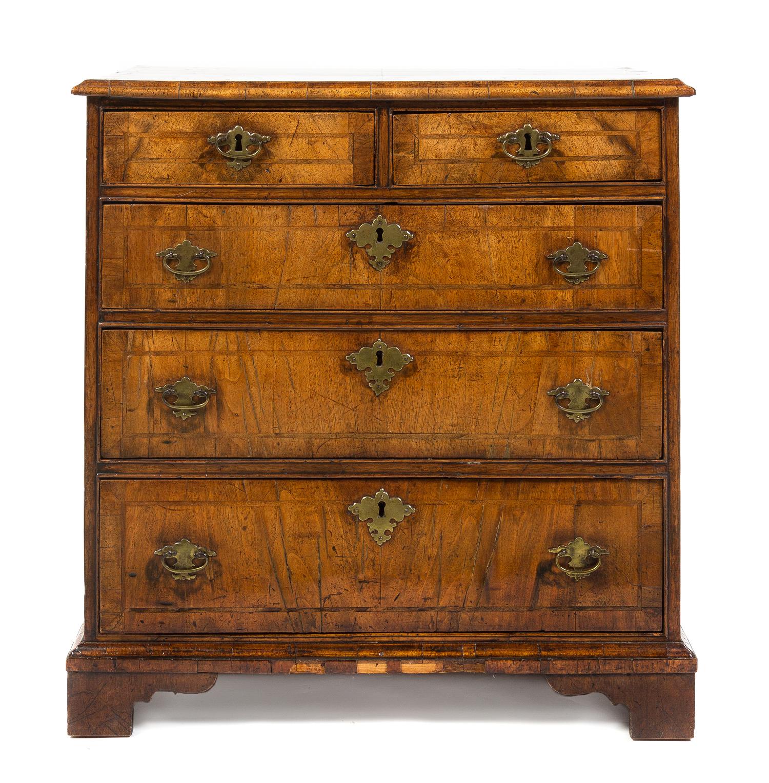 A George II Walnut Chest of Drawers, Height 29 x width 27 3/4 x depth 16 1/4 inches.