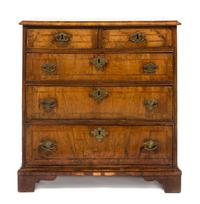 A George II Walnut Chest of Drawers, Height 29 x width 27 3/4 x depth 16 1/4 inches.
