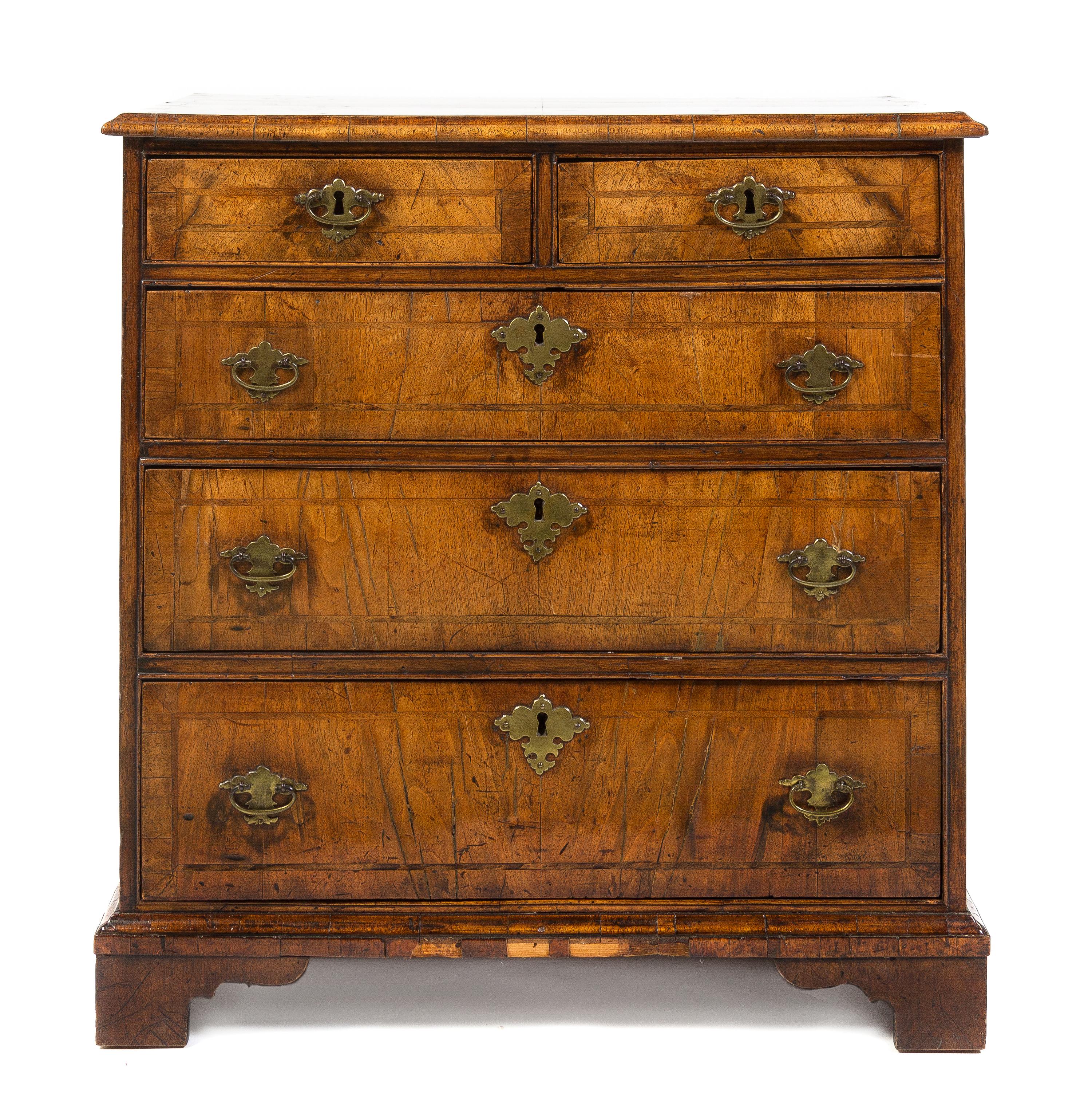 A George II Walnut Chest of Drawers, Height 29 x width 27 3/4 x depth 16 1/4 inches.