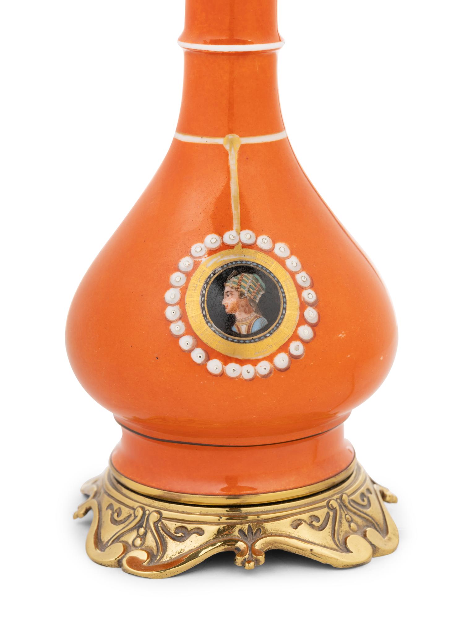 A Continental Painted Porcelain Fluid Lamp