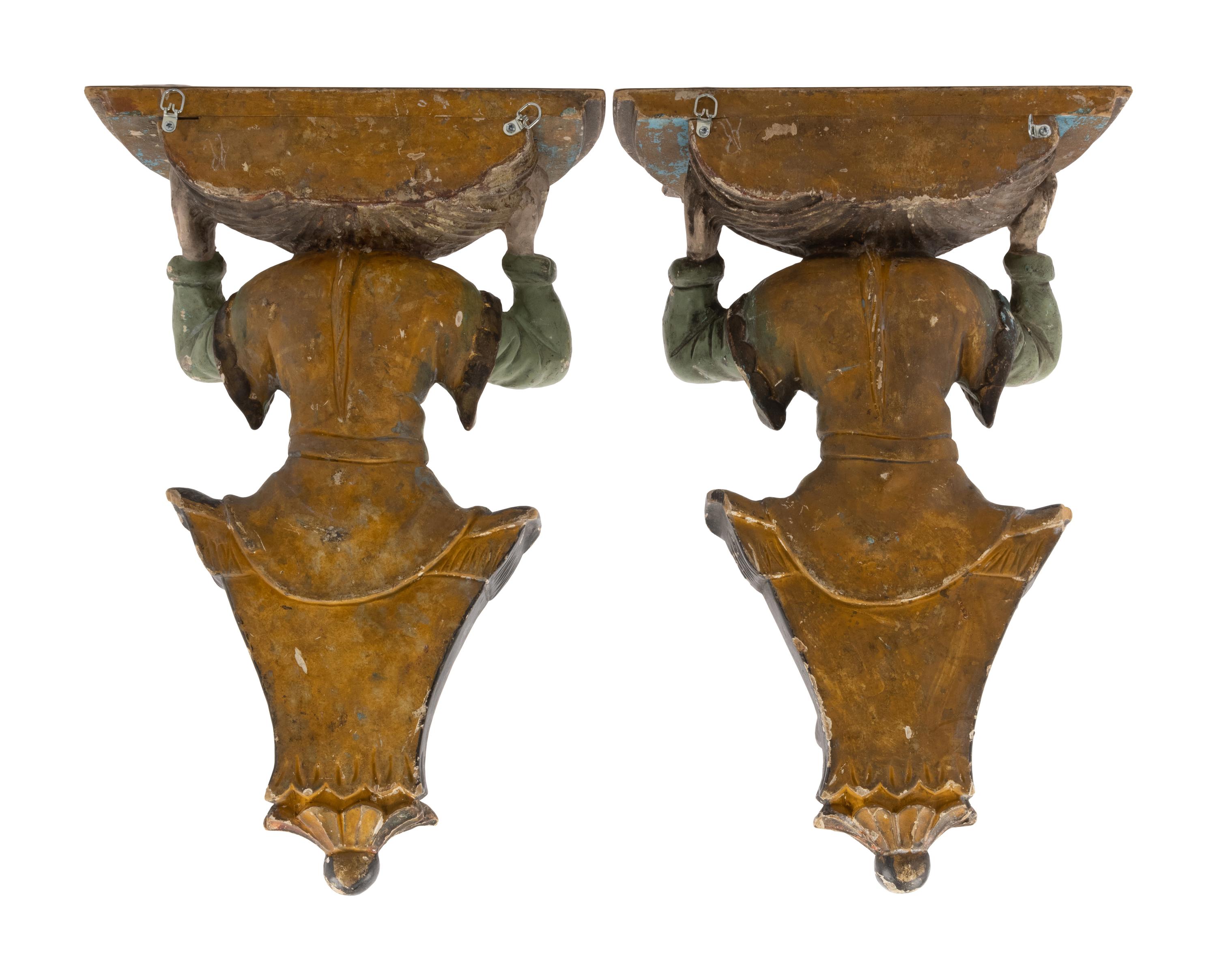 A Pair of Italian Carved and Polychrome Decorated Wood Figural Wall Brackets